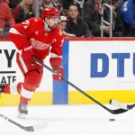Jan 8, 2026; Detroit, Michigan, USA; Detroit Red Wings center Dylan Larkin (71) skates with the puck in the second period against the Vancouver Canucks at Little Caesars Arena.