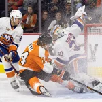 Oct 4, 2022; Philadelphia, Pennsylvania, USA; New York Islanders goaltender Ilya Sorokin (30) makes a save on Philadelphia Flyers right wing Owen Tippett (74) in front of defenseman Alexander Romanov (28) during the second period at Wells Fargo Center. Mandatory Credit: Bill Streicher-USA TODAY Sports