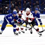 Dec 16, 2021; Tampa, Florida, USA; Ottawa Senators center Josh Norris (9) skates with the puck as Tampa Bay Lightning left wing Boris Katchouk (13) defends during the first period at Amalie Arena. Mandatory Credit: Kim Klement-USA TODAY Sports