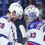 Apr 15, 2026; Tampa, Florida, USA; New York Rangers left wing Will Cuylle (50) congratulates goaltender Dylan Garand (33) after beating the Tampa Bay Lightning at Benchmark International Arena.