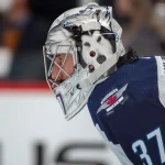 Jan 6, 2022; Denver, Colorado, USA; Winnipeg Jets goaltender Connor Hellebuyck (37) in goal against the Colorado Avalanche at Ball Arena.