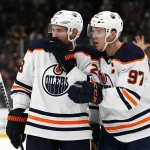 Nov 11, 2021; Boston, Massachusetts, USA; Edmonton Oilers center Connor McDavid (97) and center Leon Draisaitl (29) talk during the second period against the Boston Bruins at TD Garden.