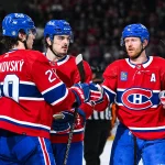 Apr 4, 2024; Montreal, Quebec, CAN; Montreal Canadiens left wing Juraj Slafkovsky (20) celebrates his goal against the Tampa Bay Lightning with =mm8 and defenseman Arber Xhekaj (72) during the third period at Bell Centre.
