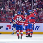 May 10, 2026; Montreal, Quebec, CAN; Montreal Canadiens forward Juraj Slafkovsky (20) celebrates with teammates including defenseman Lane Hutson (48) after scoring a goal against the Buffalo Sabres during the second period in game three of the second round of the 2026 Stanley Cup Playoffs at the Bell Centre.