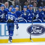 Apr 13, 2026; Toronto, Ontario, CAN; Toronto Maple Leafs right wing William Nylander (88) celebrates at the bench after scoring a goal against the Dallas Stars during the first period at Scotiabank Arena.