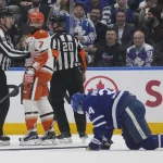 Mar 12, 2026; Toronto, Ontario, CAN; Anaheim Ducks defenseman Radko Gudas (7) looks at an injured Toronto Maple Leafs forward Auston Matthews (34) after he delivered a knee on knee hit during the second period at Scotiabank Arena.