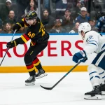 Jan 31, 2026; Vancouver, British Columbia, CAN; Vancouver Canucks forward Elias Pettersson (40) shoots against the Toronto Maple Leafs in overtime at Rogers Arena.