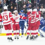 Apr 13, 2024; Toronto, Ontario, CAN; Detroit Red Wings right wing Alex DeBrincat (93) scores a goal and celebrates with Detroit Red Wings defenseman Moritz Seider (53) against the Toronto Maple Leafs during the first period at Scotiabank Arena.