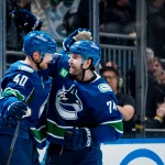 Apr 14, 2026; Vancouver, British Columbia, CAN; Vancouver Canucks forward Elias Pettersson (40) and forward Jake DeBrusk (74) celebrate DeBrusk's game winning goal against the Los Angeles Kings at Rogers Arena.