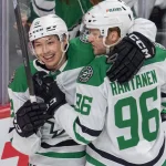 Apr 6, 2025; Saint Paul, Minnesota, USA; Dallas Stars left wing Jason Robertson (21) is congratulated by right wing Mikko Rantanen (96) after scoring on the Minnesota Wild in the first period at Xcel Energy Center. Mandatory Credit: Matt Blewett-Imagn Images