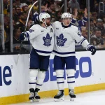 Mar 24, 2026; Boston, Massachusetts, USA; Toronto Maple Leafs right wing William Nylander (88) celebrates his goal with right wing Easton Cowan (53) during the third period against the Boston Bruins at TD Garden.