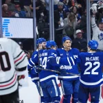 Dec 16, 2025; Toronto, Ontario, CAN; Toronto Maple Leafs center Dakota Joshua (81) scores a goal and celebrates with defenseman Jake McCabe (22) against the Chicago Blackhawks during the third period at Scotiabank Arena.