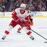 Apr 2, 2026; Philadelphia, Pennsylvania, USA; Detroit Red Wings center Dylan Larkin (71) controls the puck against the Philadelphia Flyers in the first period at Xfinity Mobile Arena.
