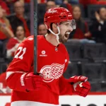 Oct 19, 2025; Detroit, Michigan, USA; Detroit Red Wings center Dylan Larkin (71) reacts after scoring a goal against the Edmonton Oilers during the second period at Little Caesars Arena.