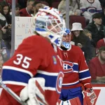6 janvier 2025; Montréal, Québec, Canada; Les gardiens de but des Canadiens de Montréal, Sam Montembeault (35) et Jakub Dobes (75), durant l'échauffement avant le match contre les Canucks de Vancouver au Centre Bell.