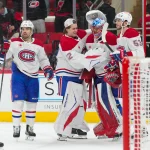 Mar 29, 2026; Raleigh, North Carolina, USA; Montreal Canadiens goaltender Jakub Dobes (75) is congratulated by goaltender Jacob Fowler (32), defenseman Noah Dobson (53) and center Alex Newhook (15) after their victory against the Carolina Hurricanes at Lenovo Center.