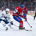 Sep 25, 2025; Montreal, Quebec, CAN; Toronto Maple Leafs forward Easton Cowan (53) defends the puck against Montreal Canadiens right wing Patrik Laine (92) during the first period at Bell Centre.