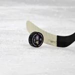 Dec 20, 2025; Montreal, Quebec, CAN; A puck with the Pittsburgh Penguins and Montreal Canadiens logo during the warmup at the Bell Centre.