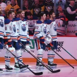 Oilers' new black alternate jersey comes into focus after insider's latest photo reveal Dec 16, 2025; Pittsburgh, Pennsylvania, USA; The Edmonton Oilers starting line-up consisting of (L to R) defenseman Mattias Ekholm (14), left wing Zach Hyman (18), center Connor McDavid (97), right wing Ryan Nugent-Hopkins (93) and defenseman Evan Bouchard (2) stand for the national anthem against the Pittsburgh Penguins at PPG Paints Arena. Mandatory Credit: Charles LeClaire-Imagn Images