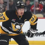 Dec 21, 2025; Pittsburgh, Pennsylvania, USA; Pittsburgh Penguins center Sidney Crosby (87) prepares for a face-off against the MontrŽal Canadiens during the first period at PPG Paints Arena.