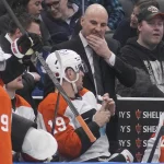 Mar 2, 2026; Toronto, Ontario, CAN; Philadelphia Flyers head coach Rick Tocchet talks with forward Garnet Hathaway (19) during a break in the action against the Toronto Maple Leafs at Scotiabank Arena.