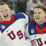 Feb 22, 2026; Milan, Italy; Matthew Tkachuk (19) of the United States and Brady Tkachuk (7) of the United States celebrate after defeating Canada in the men's ice hockey gold medal game during the Milano Cortina 2026 Olympic Winter Games at Milano Santagiulia Ice Hockey Arena. :