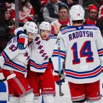 Nov 7, 2025; Detroit, Michigan, USA; New York Rangers left wing Artemi Panarin (10) celebrates his goal with center Mika Zibanejad (93) and right wing Taylor Raddysh (14) during the third period against the Detroit Red Wings at Little Caesars Arena.