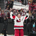 Eric Robinson's Stanley Cup day turned into an emotional moment for the Gaudreau family Jun 14, 2026; Las Vegas, Nevada, USA; Carolina Hurricanes left wing Eric Robinson (50) raises the the Stanley Cup after defeating the Vegas Golden Knights in game six of the 2026 Stanley Cup Final at T-Mobile Arena. Mandatory Credit: Stephen R. Sylvanie-Imagn Images
