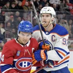 Jan 13, 2024; Montreal, Quebec, CAN; Montreal Canadiens forward Nick Suzuki (14) and Edmonton Oilers forward Connor McDavid (97) during the third period at the Bell Centre.