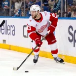 Apr 4, 2026; New York, New York, USA; Detroit Red Wings right wing Alex DeBrincat (93) looks to pass from behind the net during the third period against the New York Rangers at Madison Square Garden.