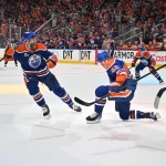 Apr 20, 2026; Edmonton, Alberta, CAN; Edmonton Oilers defenseman Mattias Ekholm (14) and right winger Kasperi Kapanen (42) celebrate a goal on the Anaheim Ducks in game one of the first round of the 2026 Stanley Cup Playoffs during the third period at Rogers Place.