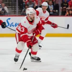 Apr 15, 2026; Sunrise, Florida, USA; Detroit Red Wings right wing Alex DeBrincat (93) moves the puck against the Florida Panthers during the second period at Amerant Bank Arena. Mandatory Credit: Sam Navarro-Imagn Images
