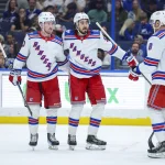 Apr 15, 2026; Tampa, Florida, USA; New York Rangers center Mika Zibanejad (93) (center) reacts with left wing Alexis Lafrenière (13) (left) and center J.T. Miller (8) (right) after scoring a goal against the Tampa Bay Lightning in the second period at Benchmark International Arena. t: