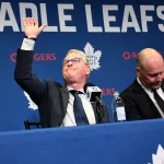 May 4, 2026; Toronto, Ontario, CANADA; Maple Leaf Sports and Entertainment CEO Keith Pelley waves to spectators after holding an introductory media conference to introduce new general manager John Chayka (not shown) and senior executive advisor Mats Sundin (right) at Real Sports Bar and Grill.