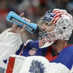 Feb 22, 2026; Milan, Italy; Connor Hellebuyck (37) of the United States takes a drink in the game against Canada in the men's ice hockey gold medal game during the Milano Cortina 2026 Olympic Winter Games at Milano Santagiulia Ice Hockey Arena.