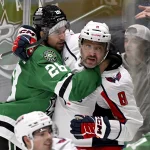 Oct 28, 2025; Dallas, Texas, USA; Dallas Stars defenseman Alexander Petrovic (28) grapples with Washington Capitals left wing Alex Ovechkin (8) during the third period at the American Airlines Center. Mandatory Credit: Jerome Miron-Imagn Images