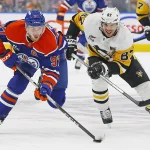 Jan 22, 2026; Edmonton, Alberta, CAN; Pittsburgh Penguins forward Sidney Crosby (87) chases Edmonton Oilers forward Connor McDavid (97) up the ice during the first period at Rogers Place. Mandatory Credit: Perry Nelson-Imagn Images