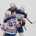 Jun 12, 2025; Sunrise, Florida, USA; Edmonton Oilers defenseman Jake Walman (96) celebrates scoring withcenter Ryan Nugent-Hopkins (93) and defenseman Darnell Nurse (25) during the third period against the Florida Panthers in game four of the 2025 Stanley Cup Final at Amerant Bank Arena.