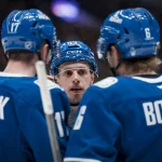 Mar 26, 2026; Vancouver, British Columbia, CAN; Vancouver Canucks forward Marco Rossi (93) talks with defenseman Filip Hronek (17) and forward Brock Boeser (6) during a stop in play against the Los Angeles Kings in the second period at Rogers Arena