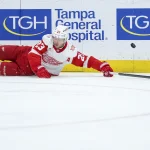 Apr 13, 2026; Tampa, Florida, USA; Detroit Red Wings left wing Lucas Raymond (23) looses the puck against the Tampa Bay Lightning in the second period at Benchmark International Arena.