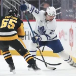 Elliotte Friedman reveals stunning Maple Leafs scenario with Erik Karlsson, Mats Sundin and Daniel Alfredsson Mar 2, 2025; Pittsburgh, Pennsylvania, USA; Toronto Maple Leafs left wing Matthew Knies (23) handles the puck against Pittsburgh Penguins defenseman Erik Karlsson (65) during the third period at PPG Paints Arena. Mandatory Credit: Charles LeClaire-Imagn Images