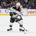 May 5, 2026; Denver, Colorado, USA; Minnesota Wild defenseman Quinn Hughes (43) prepares to shoot the puck against the Colorado Avalanche in game two of the second round of the 2026 Stanely Cup Playoffs at Ball Arena.