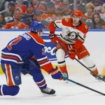 Cutter Gauthier trade to the Oilers grows amid Ducks' cap crunch Apr 22, 2026; Edmonton, Alberta, CAN; Anaheim Ducks forward Cutter Gauthier (61) looks to make a pass in front of Edmonton Oilers defensemen Evan Bouchard (2) during the second period in game two of the first round of the 2026 Stanley Cup Playoffs at Rogers Place. Mandatory Credit: Perry Nelson-Imagn Images