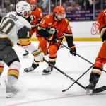 May 10, 2026; Anaheim, California, USA; Anaheim Ducks left wing Cutter Gauthier (61) skates with the puck against Vegas Golden Knights center Colton Sissons (10) during the second period in game four of the second round of the 2026 Stanley Cup Playoffs at Honda Center.
