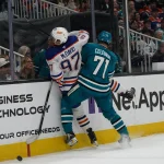 Apr 8, 2026; San Jose, California, USA; San Jose Sharks center Macklin Celebrini (71) and Edmonton Oilers center Connor McDavid (97) battle for the puck in the second period at SAP Center at San Jose. :