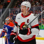 Dec 22, 2024; Edmonton, Alberta, CAN; Ottawa Senators forward Brady Tkachuk (7) looks for a loose puck against the Edmonton Oilers at Rogers Place. Mandatory Credit: Perry Nelson-Imagn Images