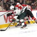 Nov 26, 2025; Chicago, Illinois, USA; Chicago Blackhawks defenseman Alex Vlasic (72) defenseman Louis Crevier (46) and Minnesota Wild right wing Mats Zuccarello (36) go for the puck during the first period at United Center. Mandatory Credit: David Banks-Imagn Images
