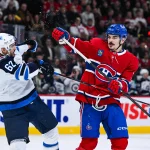Dec 3, 2025; Montreal, Quebec, CAN; Winnipeg Jets right wing Nino Niederreiter (62) and Montreal Canadiens defenseman Arber Xhekaj (72) scuffle during the first period at Bell Centre.