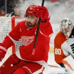 Mar 28, 2026; Detroit, Michigan, USA; Detroit Red Wings center Dylan Larkin (71) celebrates after scoring on Philadelphia Flyers goaltender Dan Vladar (80) in the second period at Little Caesars Arena.