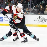 Jan 4, 2024; Seattle, Washington, USA; Ottawa Senators left wing Brady Tkachuk (7) shoots the puck against the Seattle Kraken during the first period at Climate Pledge Arena. Mandatory Credit: Joe Nicholson-USA TODAY Sports